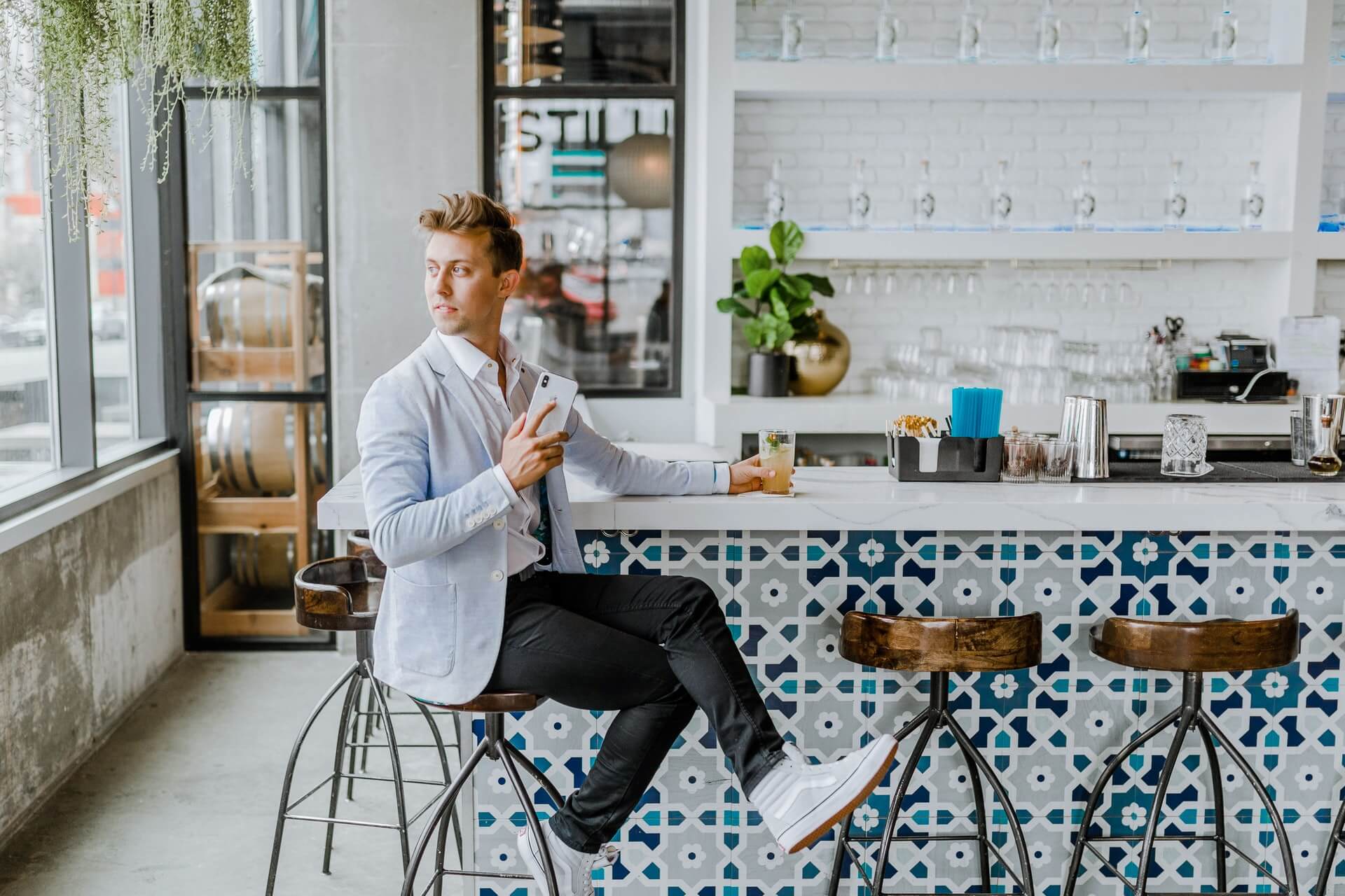 A man waiting in a cafe for someone that will never show up.